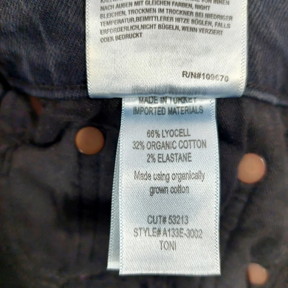 Agolde Black Mid Rise Toni in Montage Stretch Jeans